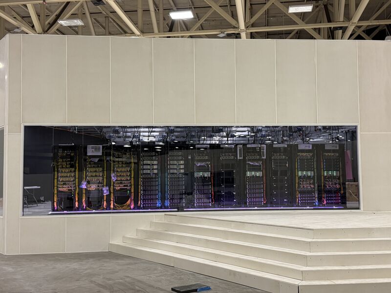 Operations team at workstations facing a wall of monitors inside a completed EcoTech facility